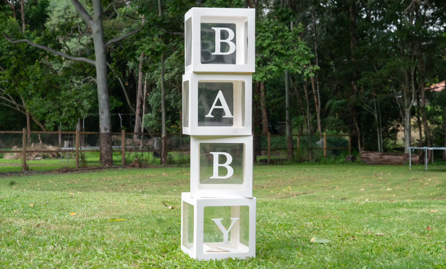 Clear boxes with BABY letters - fill with balloons, or party decorations