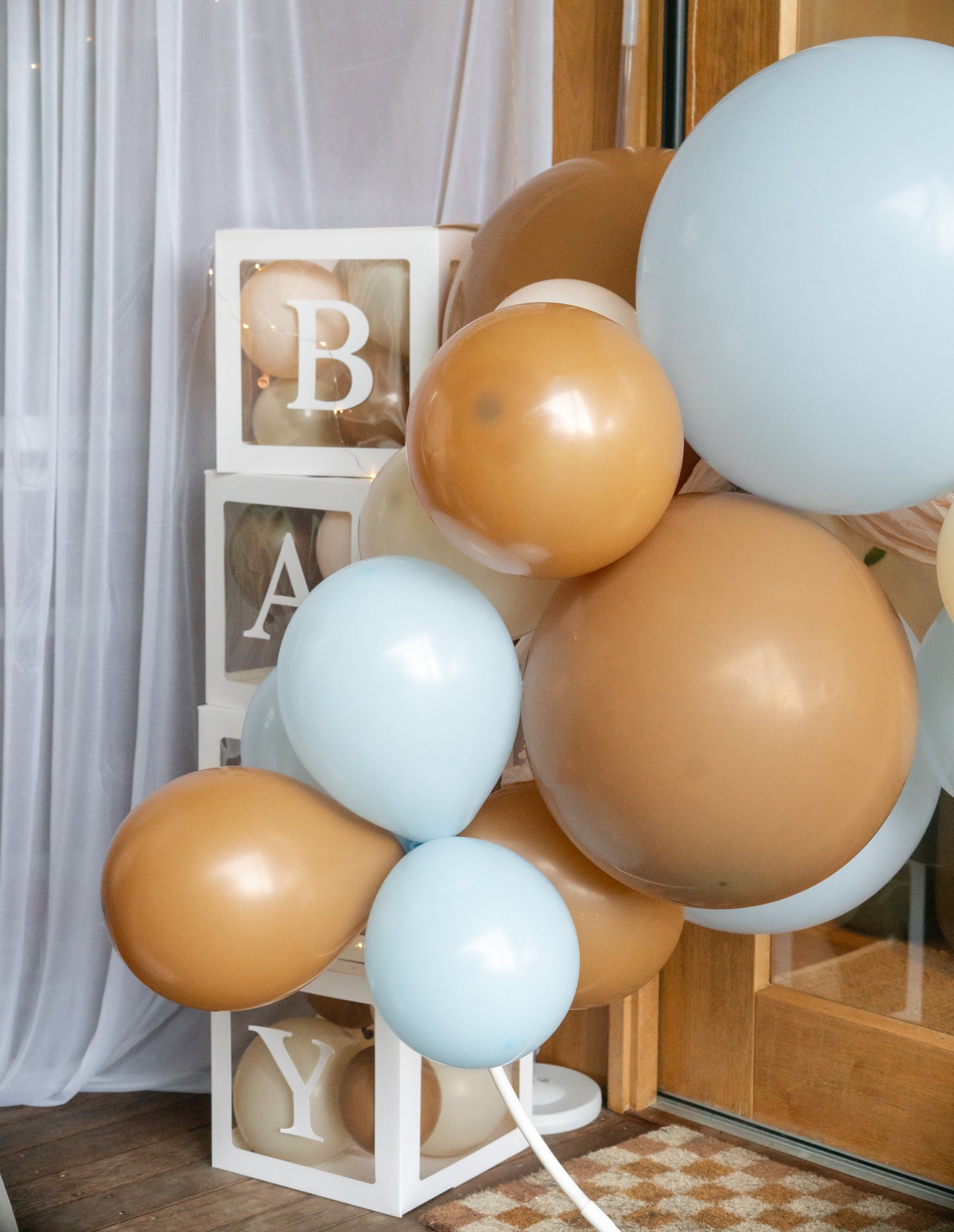 Clear boxes with BABY letters - fill with balloons, or party decorations